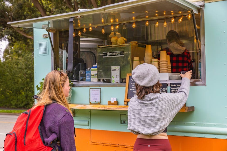 Food truck serving customers at the street counter