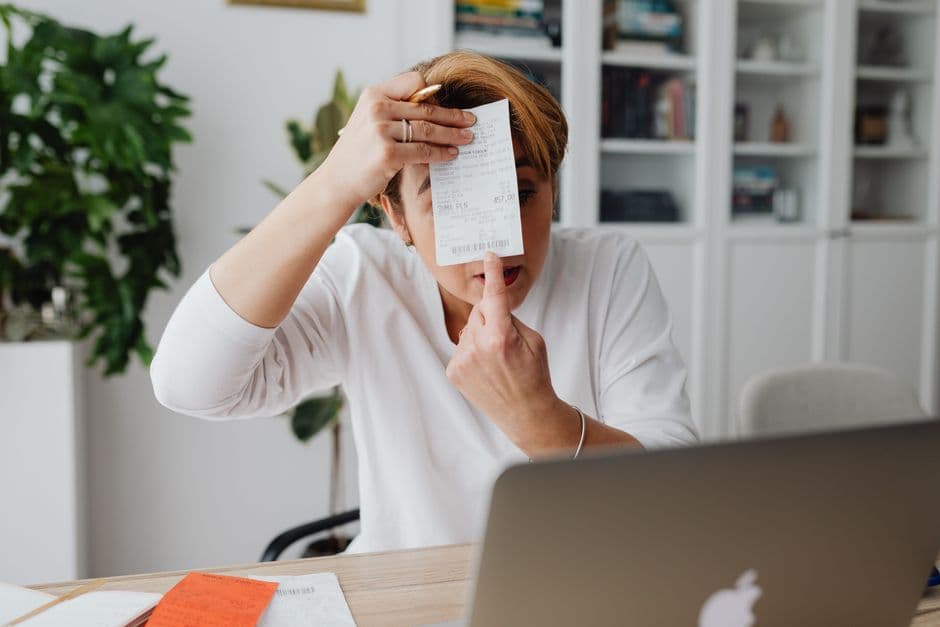 Small business owner preparing compliant electronic invoices on a laptop
