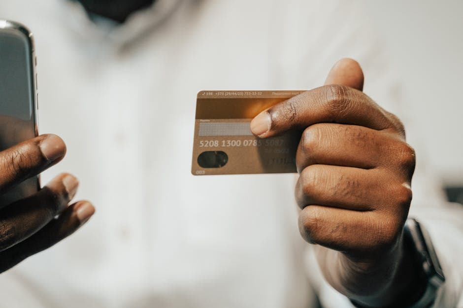 Senegalese shopkeeper taking a mobile money payment on a POS app