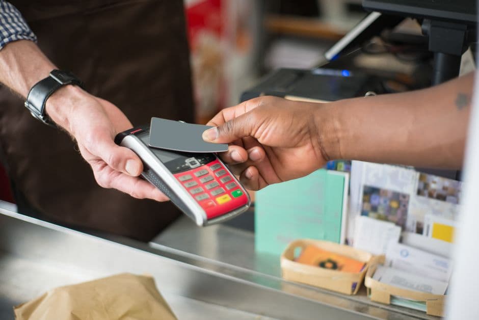 Payment terminal and smartphone till at a Nigerian shop counter