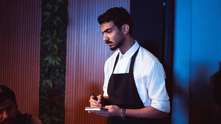 Restaurant server taking an order on a tablet point of sale