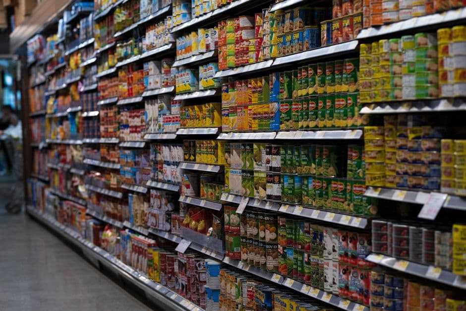 Supermarket aisle with stocked shelves