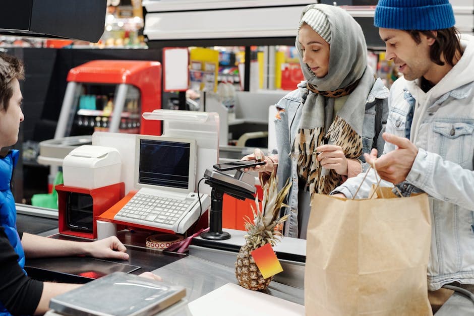 Supermarket cashier scanning a barcode at checkout