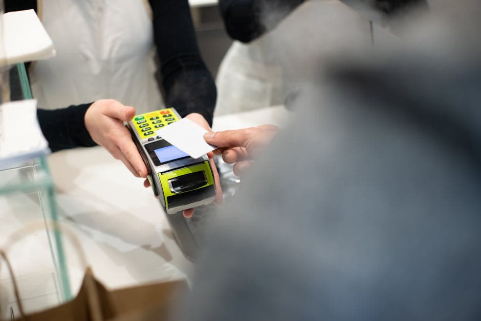 Card machine and smartphone point of sale at a South African shop counter